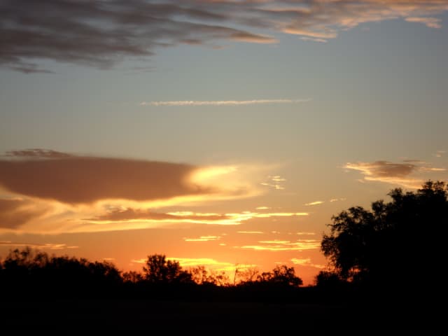 Sun 27, a sunrise and sunset photograph by Bob McNeil